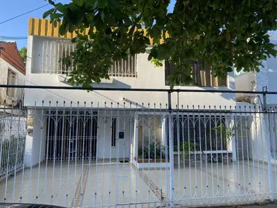 a white fence in front of a house at Habitación cerca al aeropuerto # 4 in Cartagena de Indias