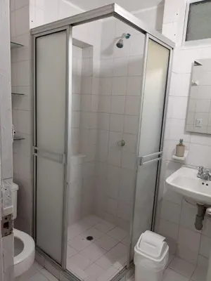 a bathroom with a shower and a toilet and a sink at Habitación cerca al aeropuerto # 4 in Cartagena de Indias