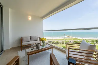 a living room with a view of the ocean at Charming Seafront Loft in Cartagena de Indias