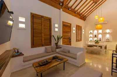a living room with a couch and a table at Casa Bali Castillo View Private Pool & Rooftop, Near Historic Center in Cartagena de Indias