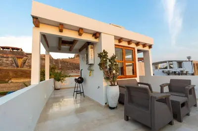 a villa with a view of the roofs at Casa Bali Castillo View Private Pool & Rooftop, Near Historic Center in Cartagena de Indias