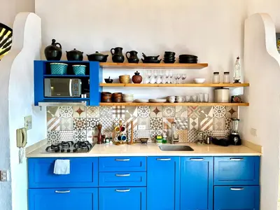 a kitchen with blue cabinets and a counter top at Calamari Homes - El Porvenir 305 - Walled city in Cartagena de Indias