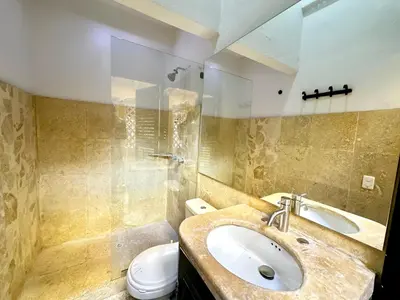 a bathroom with a sink and a toilet at Calamari Homes - El Porvenir 305 - Walled city in Cartagena de Indias