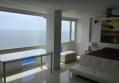 a living room with a couch and a glass table at Vista Divisadero 25 in Cartagena de Indias