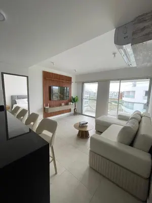 a living room with a couch and chairs at An apartment in Serena del Mar in Serena del Mar