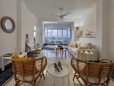 a living room with a couch and chairs at by Calamari Homes-Plaza Bolivar Penthouse Sea view in Cartagena de Indias