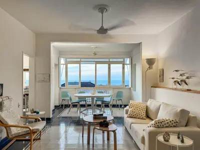 a living room with a couch and a table at by Calamari Homes-Plaza Bolivar Penthouse Sea view in Cartagena de Indias