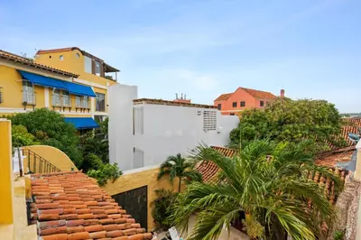 a view of a city with buildings and palm trees at Reve hotel in Cartagena de Indias