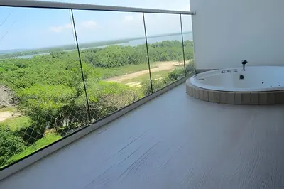 a bathroom with a large window and a bath tub at Exclusivo apartamento en Cielo Mar - Américas 609 in Cartagena de Indias