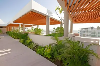 a building with a walkway with plants at Exclusivo apartamento en Cielo Mar - Américas 609 in Cartagena de Indias