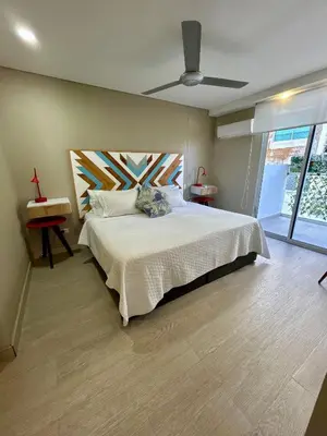 a bedroom with a bed and a ceiling fan at Exclusivo apartamento en Cielo Mar - Américas 609 in Cartagena de Indias