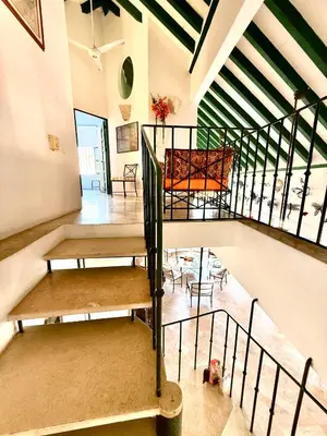 a room with a spiral staircase in a building at by Calamari Homes - El Porvenir 402 walled city in Cartagena de Indias
