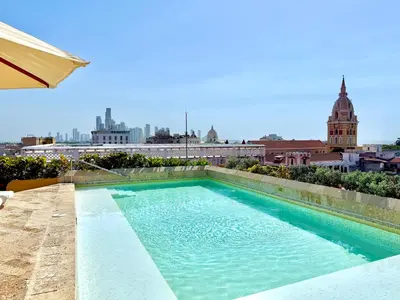 a swimming pool on the roof of a building at by Calamari Homes - El Porvenir 402 walled city in Cartagena de Indias