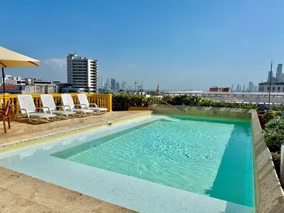 a swimming pool on top of a building at by Calamari Homes - El Porvenir 402 walled city in Cartagena de Indias