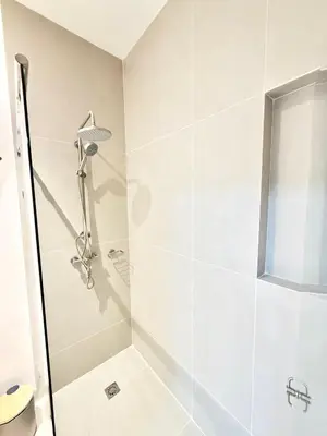a bathroom with a shower with a glass door at Baia Krystal P4, 1A in Cartagena de Indias