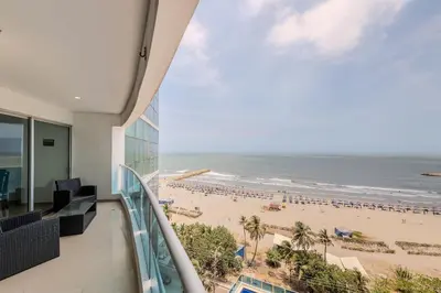 a view of the beach from the balcony of a building at Espectacular vista al mar - Edificio Infinito 1002 in Cartagena de Indias