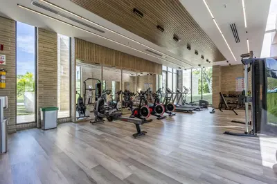 a gym with lots of treadmills and machines at Brand new 4BR Villa at Calablanca in Cartagena de Indias