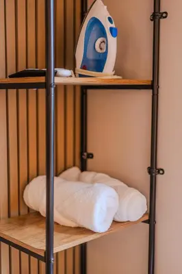 a shelf with towels and a crib at Almería Apt, Spacious Studio Near Old Town in Cartagena de Indias