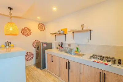 a kitchen with a sink and a refrigerator at Almería Apt, Spacious Studio Near Old Town in Cartagena de Indias