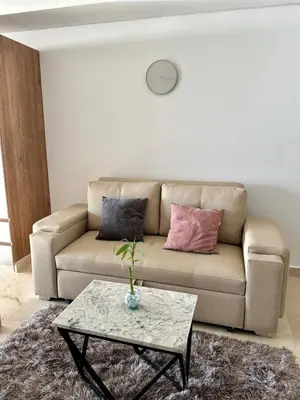 a living room with a couch and a table at Cartagena Beach - Sea View - Airport 5 min in Cartagena de Indias