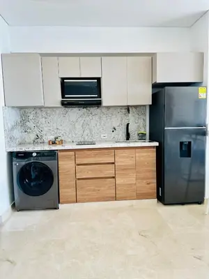 a kitchen with a stainless steel refrigerator and a dishwasher at Cartagena Beach - Sea View - Airport 5 min in Cartagena de Indias