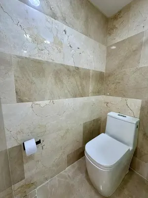 a bathroom with a toilet and a roll of toilet paper at Cartagena Beach - Sea View - Airport 5 min in Cartagena de Indias