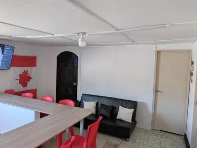 a room with a table and chairs and a couch at English power Exotic point in Barranquilla