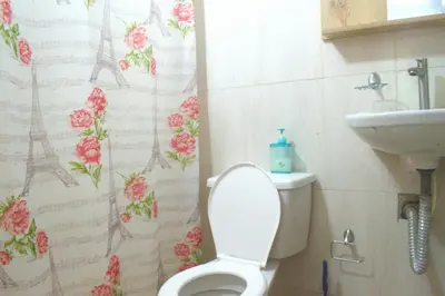 a bathroom with a toilet and a sink at Mango Tree Island 420 in Tierra Bomba