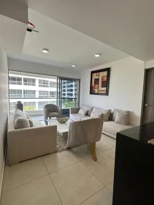a living room with a couch and a table at Apartamento cómodo en Conjunto residencial Castelo Cartagena in Cartagena de Indias