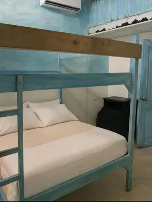 a bunk bed in a room with a bunk bed at Casamar sol caribe in Cartagena de Indias
