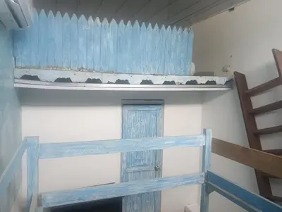 a room with a shelf and a window and a ladder at Casamar sol caribe in Cartagena de Indias