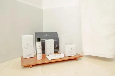a shelf with a bunch of products on it at Sky Collection Lifestyle Hotel & Suites Barranquilla in Barranquilla