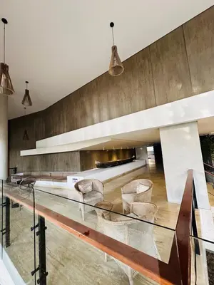 a lobby with a long glass table and chairs at Exclusive Apartment with Private Jacuzzi in Cartagena de Indias