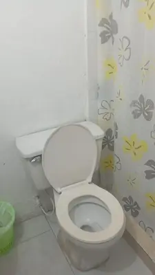 a bathroom with a white toilet in a room at hotel restaurante doña nerta in Cartagena de Indias