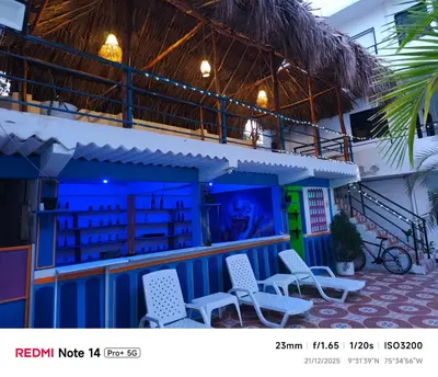 a building with chairs in front of it at Hotel donde Tito in Tolú
