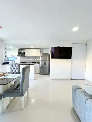 a living room with a couch and a table at Azul Caribe 104 in Coveñas