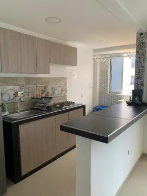 a kitchen with a sink and a counter top at Prada Caribe 303 in Coveñas