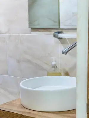 a white bathroom sink with a soap bottle on it at Celeste Caribe 101A in Coveñas