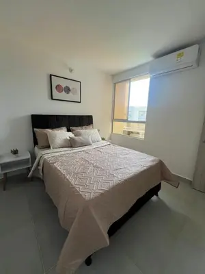 a bedroom with a large bed and a window at Apartamento Cartagena Moderno y Comodo in Manzanillo del Mar