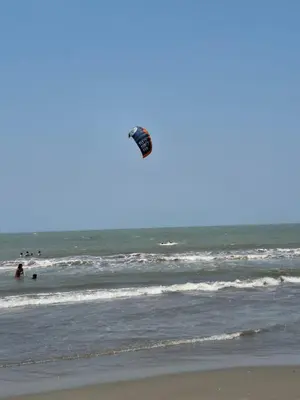 a kite flying in the air over the ocean at Apartamento Cartagena Moderno y Comodo in Manzanillo del Mar