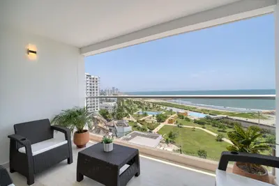 a living room with a large window with a view of the ocean at Sea View Modern Loft in Cartagena de Indias