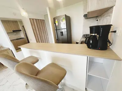 a kitchen with a counter with a coffee maker on it at Wow que vista!! Frente Ecoparque 7min CC Buenavista in Puerto Colombia