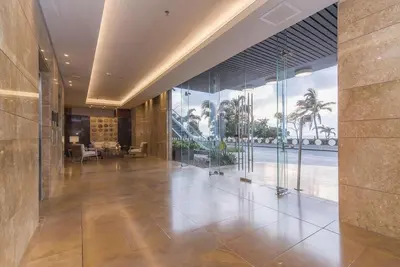 an empty lobby with glass walls and a large hallway at luxury Aparment Ocean view H2 condominium apto 2105 in Cartagena de Indias