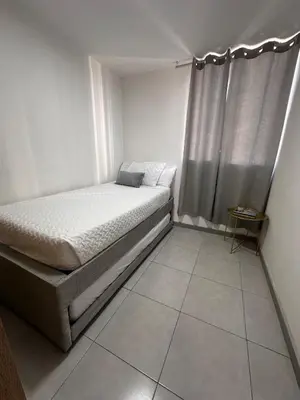 a small bedroom with a bed and a window at Apartment in Cartagena Sea View & Ocean View Cerca al centro Histórico in Cartagena de Indias