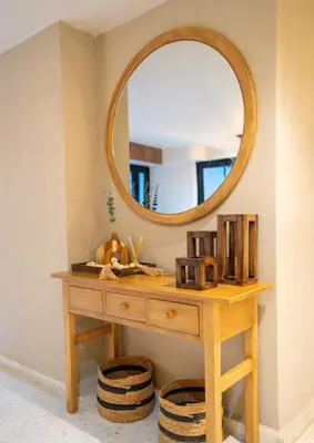 a dressing table with a mirror on a wall at Apartment in Cartagena Sea View & Ocean View Cerca al centro Histórico in Cartagena de Indias