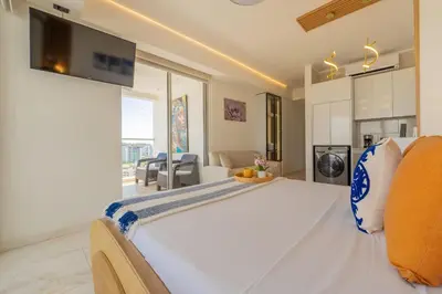 a bedroom with a large white bed in a room at CB1530 Hermosa Suite en Crespo Vista 180º in Cartagena de Indias