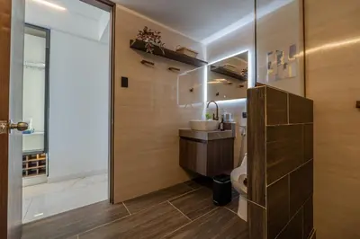 a bathroom with a sink and a toilet at CB1530 Hermosa Suite en Crespo Vista 180º in Cartagena de Indias