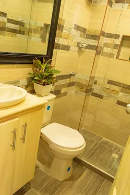 a bathroom with a toilet and a sink and a shower at Inca Caribe 302 in Coveñas