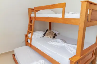 a couple of bunk beds in a room at Raíces Caribe 503 in Coveñas