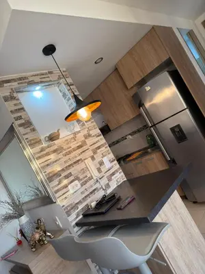an overhead view of a kitchen with a counter and a desk at ÁME Living in Cartagena de Indias
